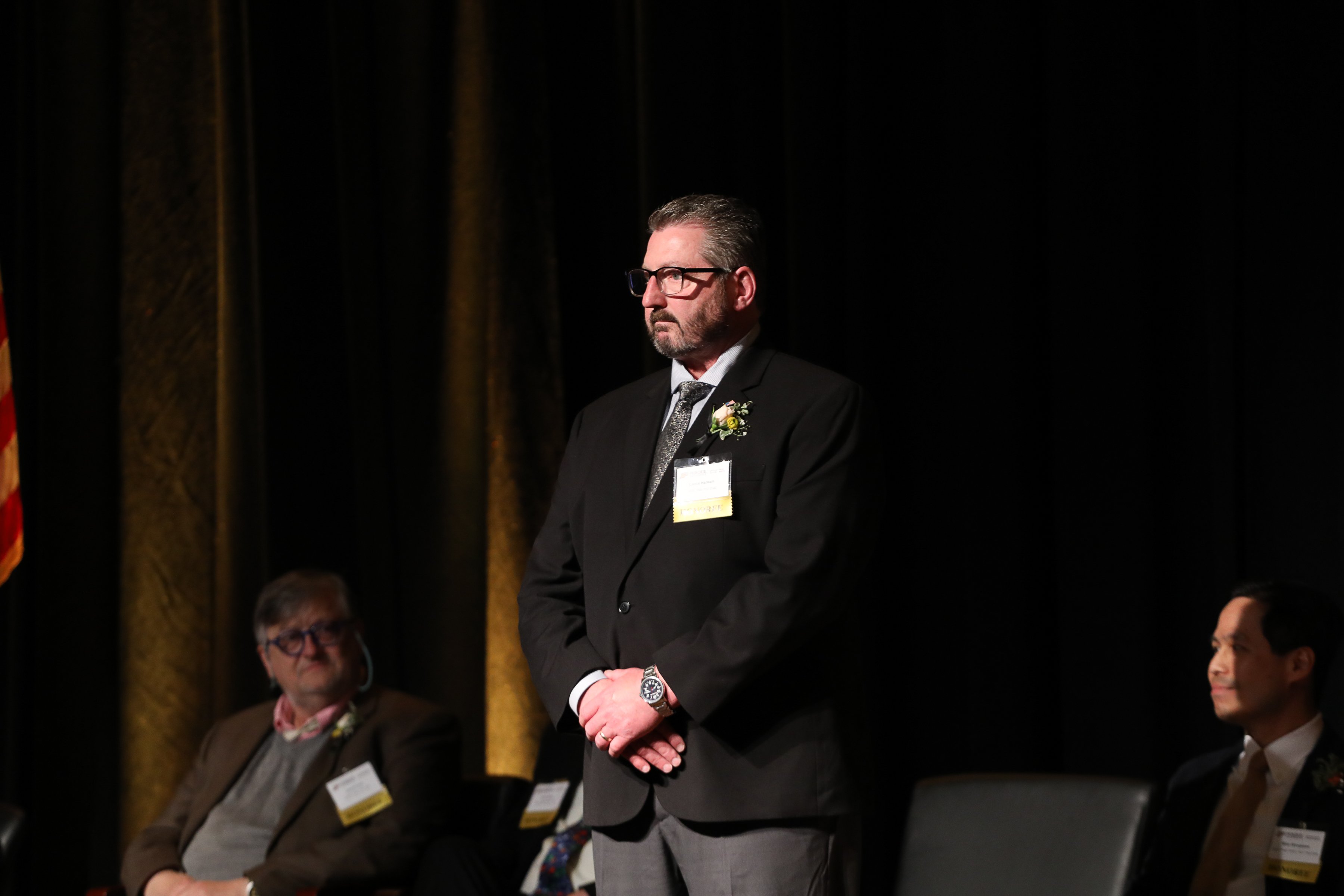 Lance Hansen is honored on stage during the Purdue Distinguished Alumni Awards. 