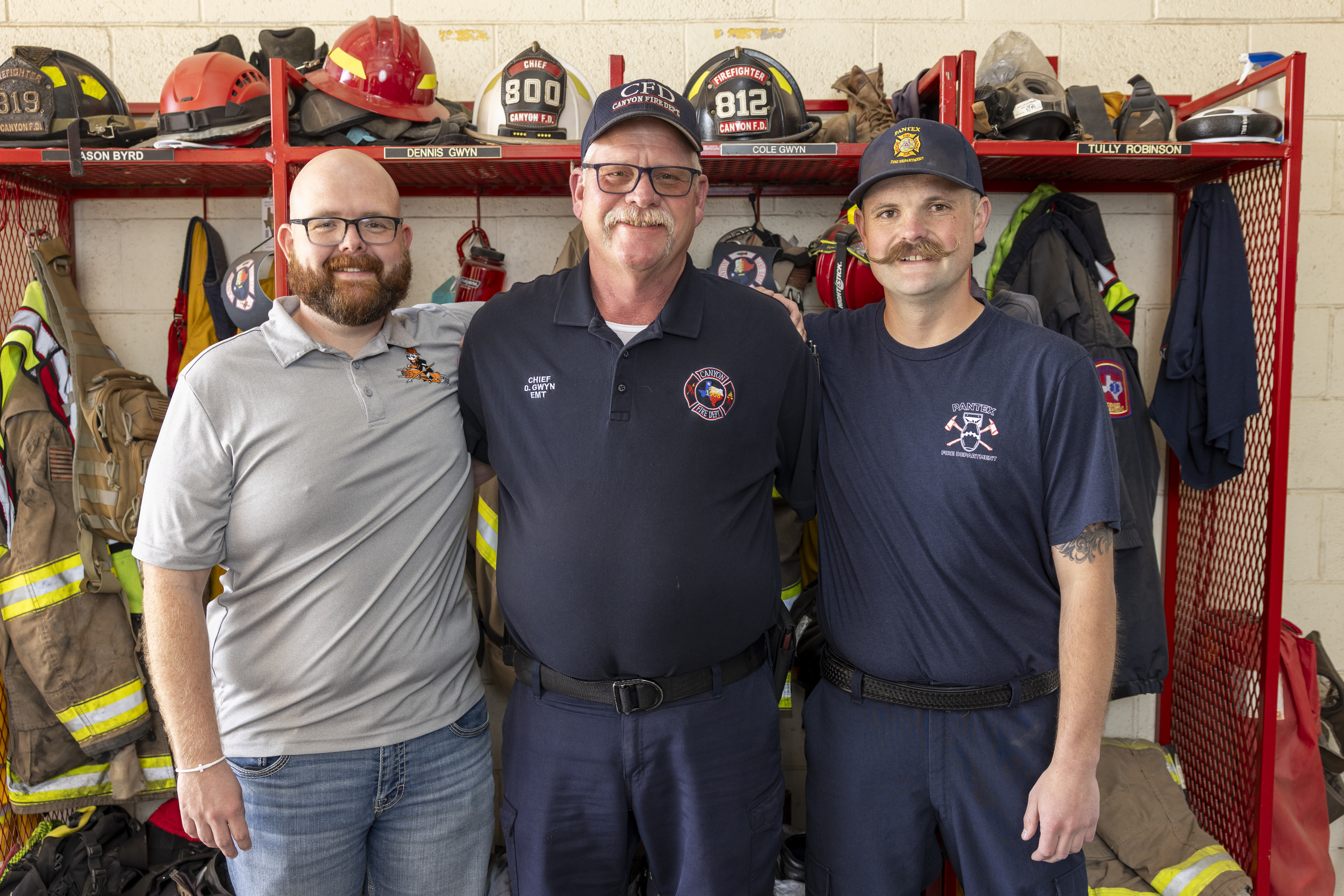 Wyatt (left) and Cole Gwyn (right) pose with their dad Dennis (middle). 