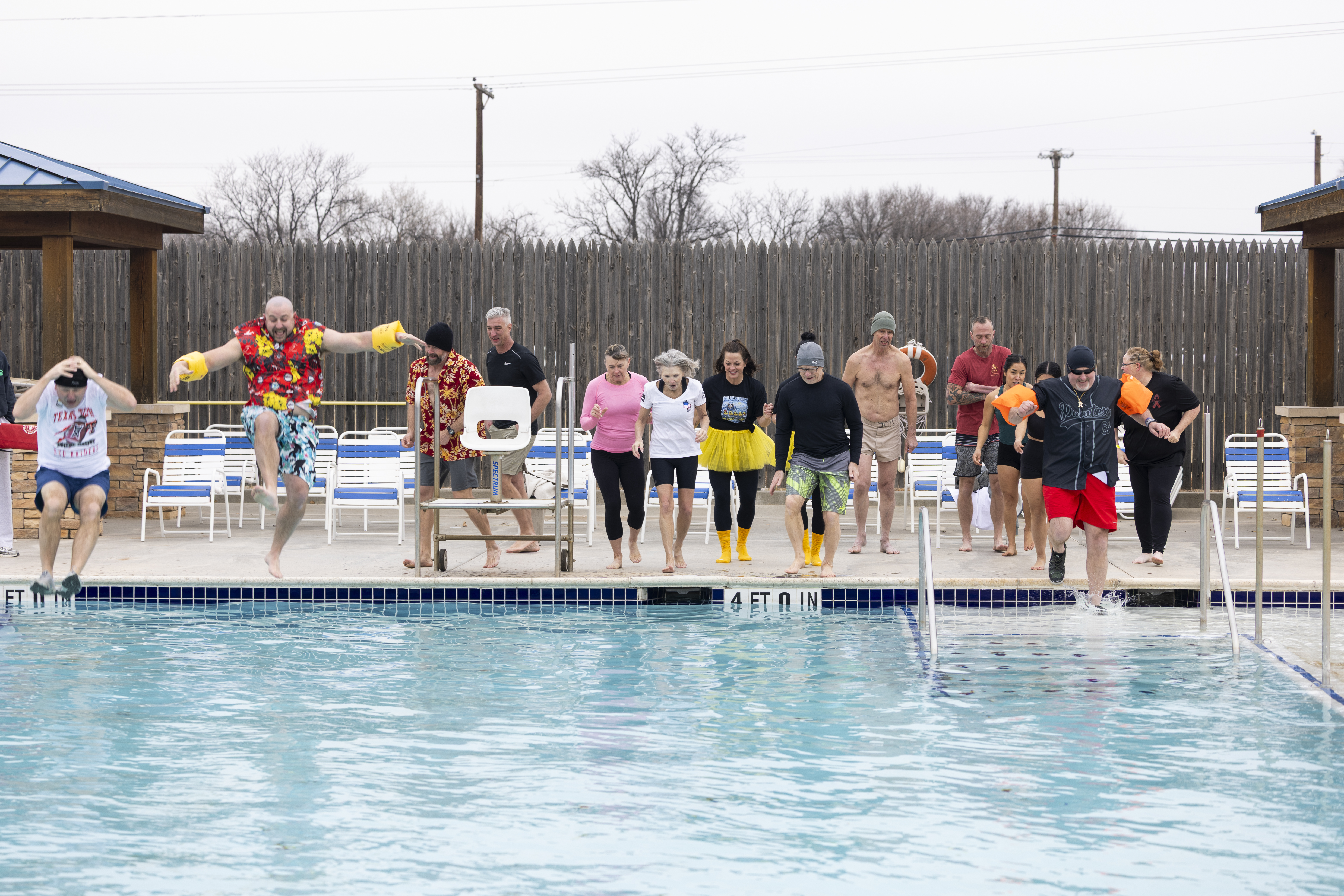 A group of Pantexans jumps into freezing water in 24-degree weather in support of the Amarillo Polar Plunge.