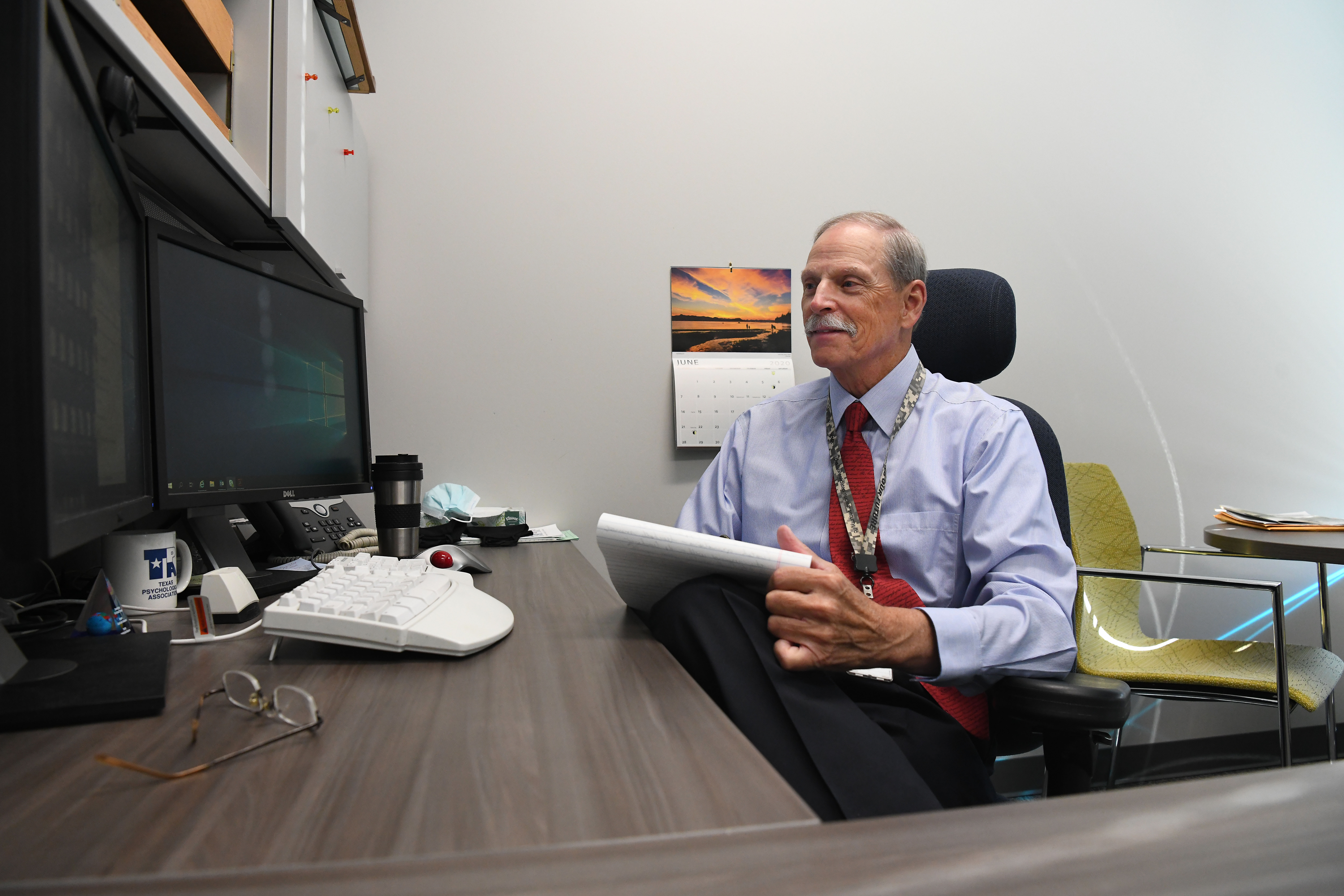 Dr. Mark Izzard conducts a telepsychology session from his office at Pantex.