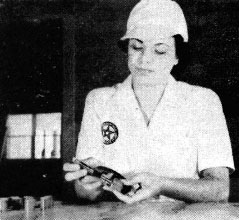 Ernestine O’Brien uses a micrometer to ensure exactness in production