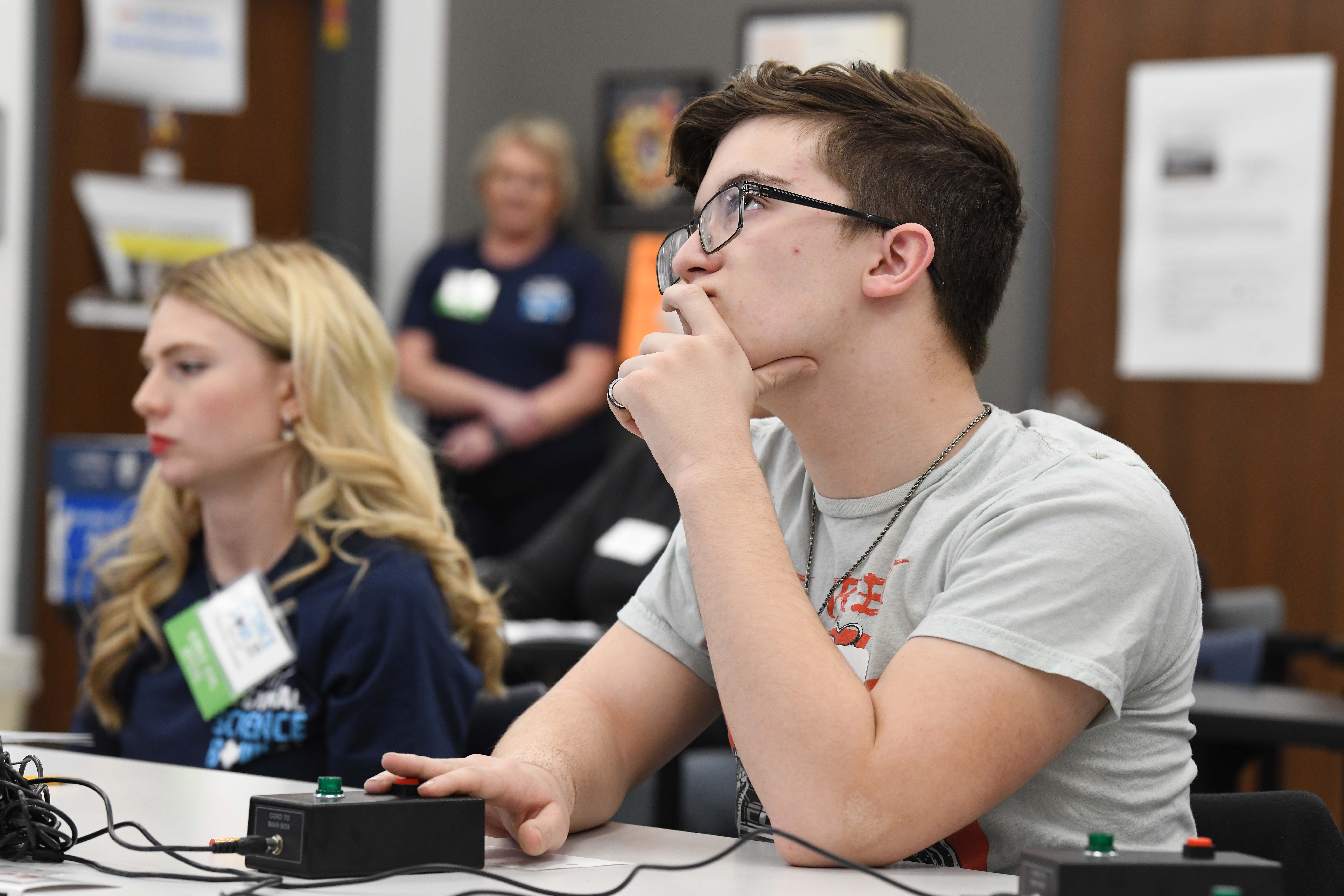 Devin C. participates in a round of the 2024 Regional High School Science Bowl. 