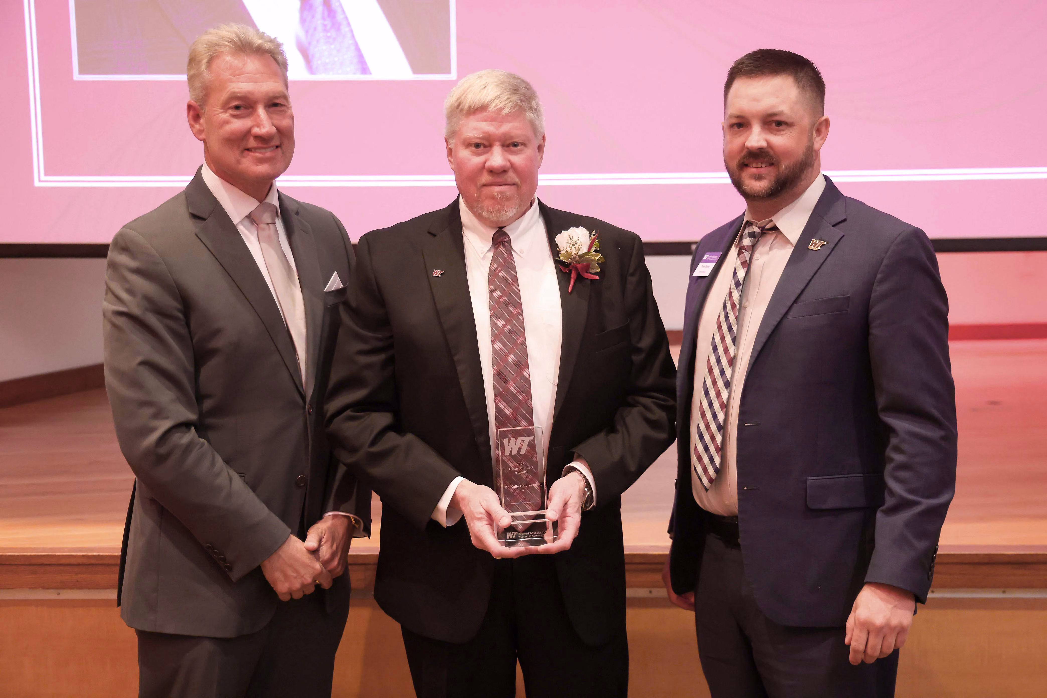 PXD President and General Manager Kelly Beierschmitt (center) receiving the 2026 WT Distinguished Alumni Award with WT Interim President Neil Terry (left) and WT Alumni Association Board President Trevor Barnes (right). Photo provided by West Texas A&M University. 